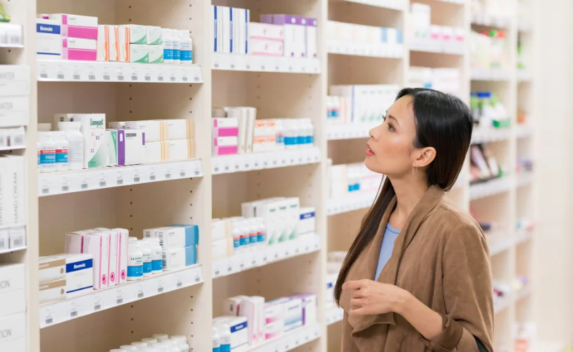 Customer browsing over-the-counter products in a pharmacy